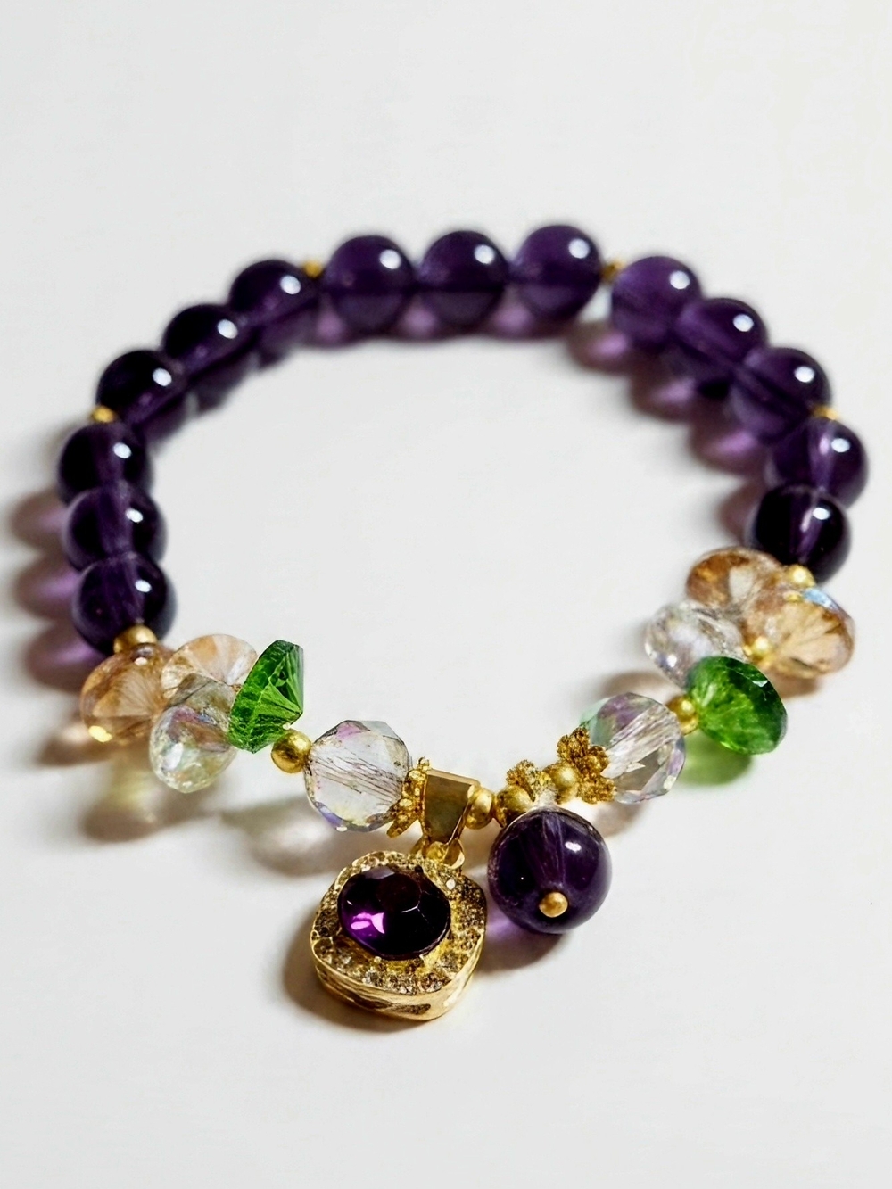 Amethyst Beaded Charm Bracelet with Gold Accents and Green Highlights